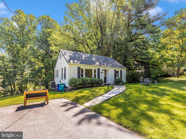5421 Bartonsville Rd, Frederick, MD 21704 - view of front facade with a front yard, brick siding, and cooling unit
