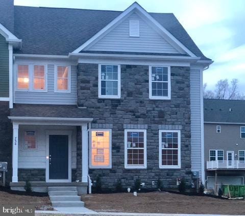 734 Sun Valley Ct, Chester Springs, PA 19425 - view of front of home featuring stone siding and roof with shingles