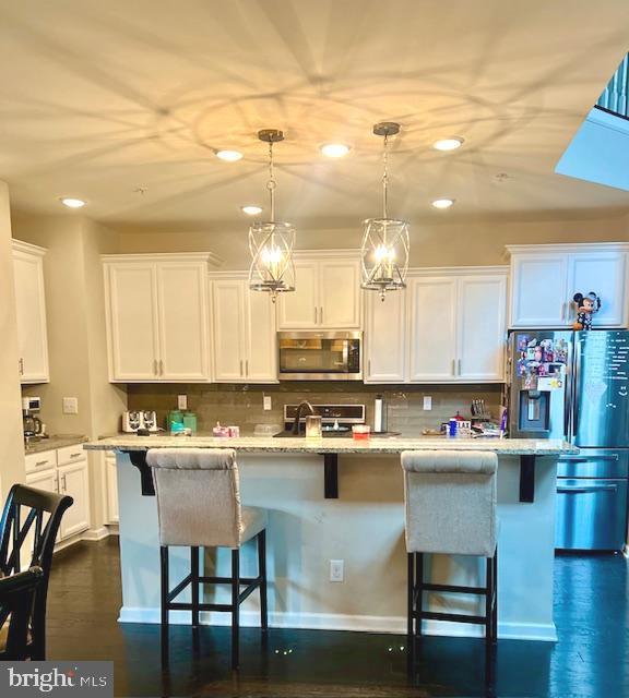734 Sun Valley Ct, Chester Springs, PA 19425 - kitchen featuring stainless steel appliances, recessed lighting, white cabinets, decorative backsplash, and pendant lighting