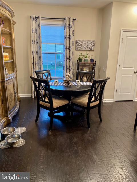 734 Sun Valley Ct, Chester Springs, PA 19425 - dining area featuring dark wood-style floors and baseboards