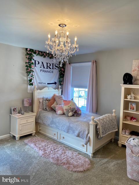 734 Sun Valley Ct, Chester Springs, PA 19425 - bedroom with a chandelier and carpet flooring