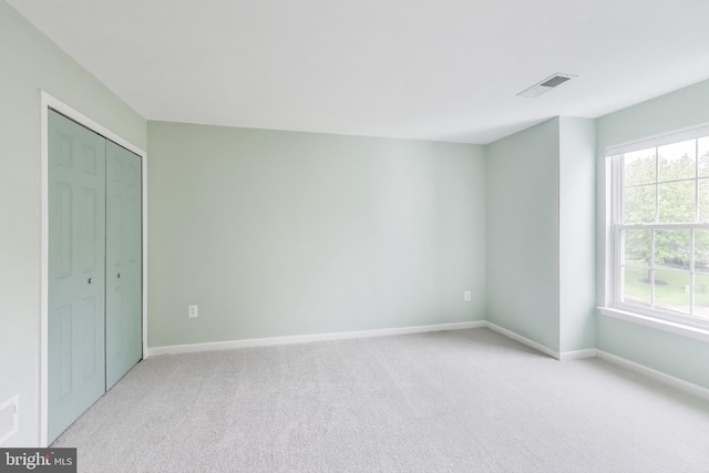 35551 Sarasota St, Round Hill, VA 20141 - unfurnished bedroom featuring light carpet, multiple windows, and baseboards
