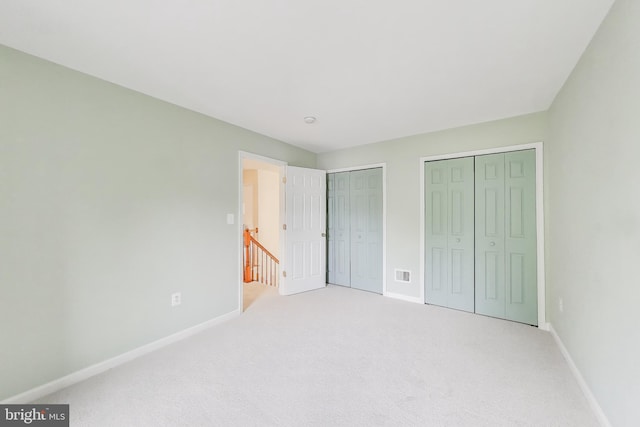 35551 Sarasota St, Round Hill, VA 20141 - unfurnished bedroom with multiple closets, baseboards, and carpet