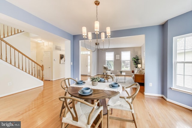 35551 Sarasota St, Round Hill, VA 20141 - dining room featuring stairway, light wood finished floors, baseboards, and healthy amount of natural light