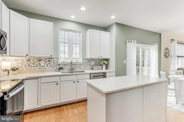 35551 Sarasota St, Round Hill, VA 20141 - kitchen with a sink, tasteful backsplash, light wood-type flooring, appliances with stainless steel finishes, and plenty of natural light