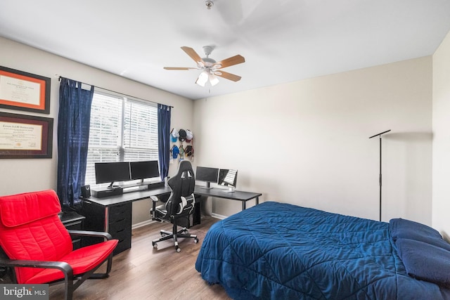 43825 Hickory Corner Ter Unit 104, Ashburn, VA 20147 - bedroom with wood finished floors, a desk, and ceiling fan