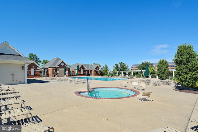 43825 Hickory Corner Ter Unit 104, Ashburn, VA 20147 - community pool featuring a patio area