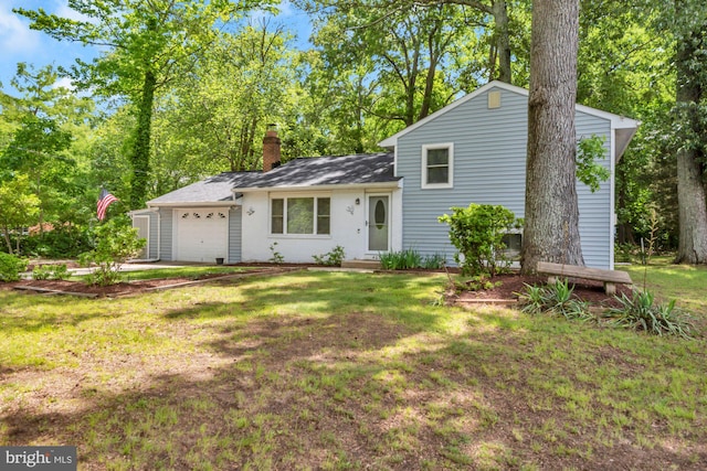 4097 Shoreham Beach Rd, Edgewater, MD 21037 - split level home featuring a chimney, a front lawn, and a garage