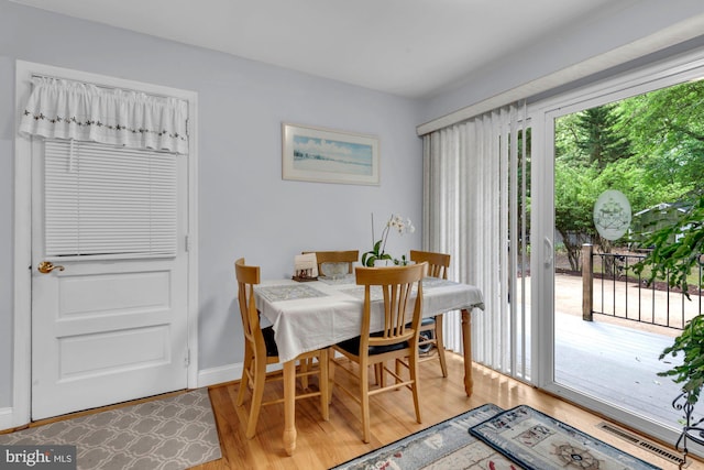 4097 Shoreham Beach Rd, Edgewater, MD 21037 - dining area with light wood finished floors and baseboards