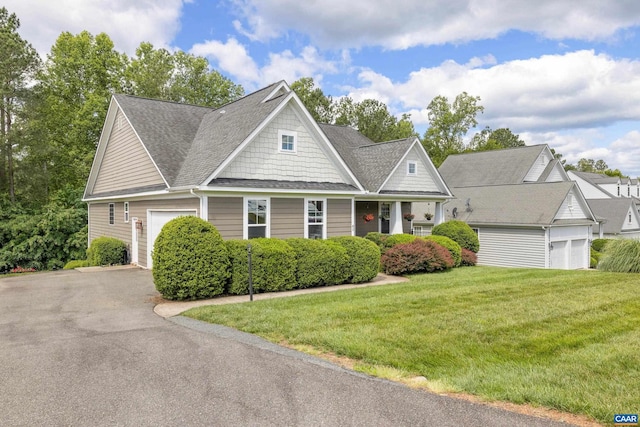 83 Mossy Creek Ct, Zion Crossroads, VA 22942 - view of front facade with a garage, driveway, a front lawn, and a shingled roof