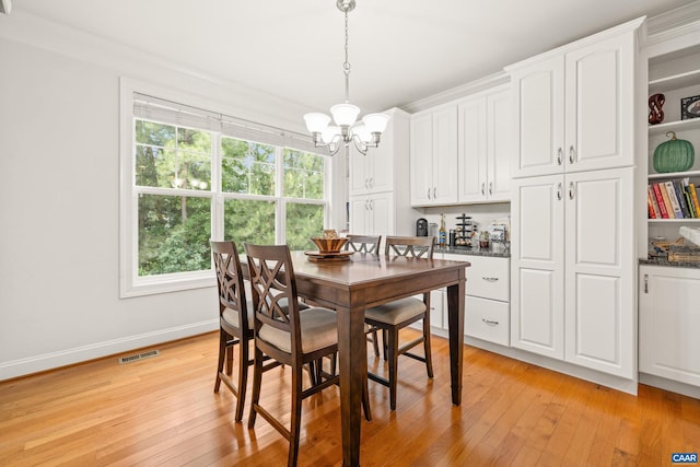 83 Mossy Creek Ct, Zion Crossroads, VA 22942 - dining area with a chandelier, light wood-type flooring, and baseboards