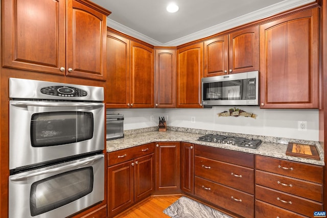 83 Mossy Creek Ct, Zion Crossroads, VA 22942 - kitchen with stainless steel appliances, light stone counters, light wood-style floors, and ornamental molding