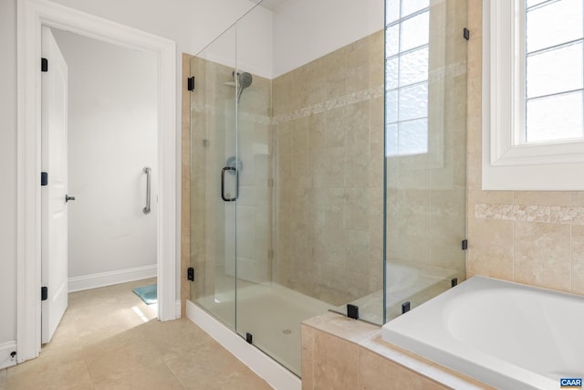 83 Mossy Creek Ct, Zion Crossroads, VA 22942 - full bathroom featuring a bath, a shower stall, tile patterned floors, and baseboards