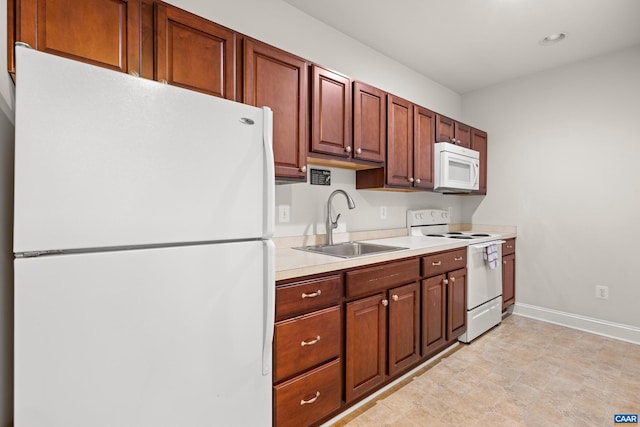 83 Mossy Creek Ct, Zion Crossroads, VA 22942 - kitchen featuring white appliances, a sink, baseboards, light countertops, and recessed lighting