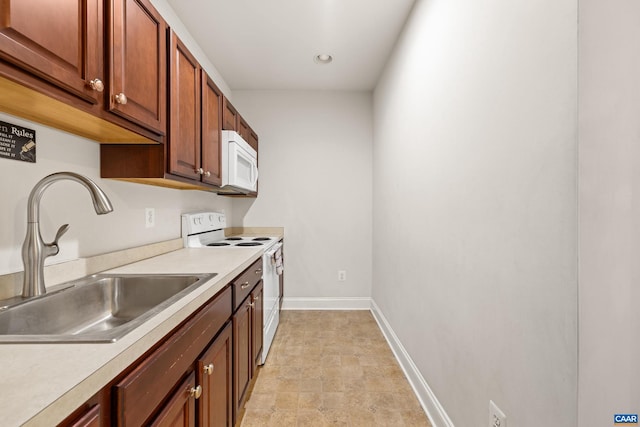 83 Mossy Creek Ct, Zion Crossroads, VA 22942 - kitchen featuring white appliances, a sink, light countertops, baseboards, and recessed lighting