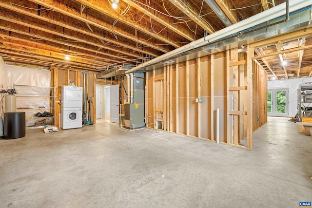 83 Mossy Creek Ct, Zion Crossroads, VA 22942 - basement featuring stacked washing machine and dryer, heating unit, and a water softener system