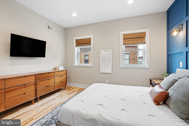 2409 S Watts St, Philadelphia, PA 19148 - bedroom featuring multiple windows, light wood-style flooring, recessed lighting, and baseboards