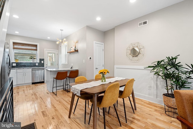 2409 S Watts St, Philadelphia, PA 19148 - dining room with light wood-type flooring, a chandelier, recessed lighting, and baseboards