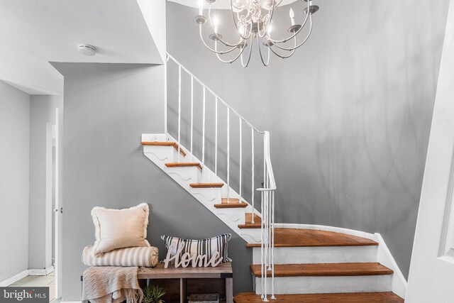 521 Rhode Island Ave, Cherry Hill, NJ 08002 - stairway featuring baseboards and a chandelier