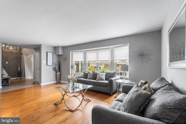 521 Rhode Island Ave, Cherry Hill, NJ 08002 - living room with a chandelier, wood finished floors, and baseboards