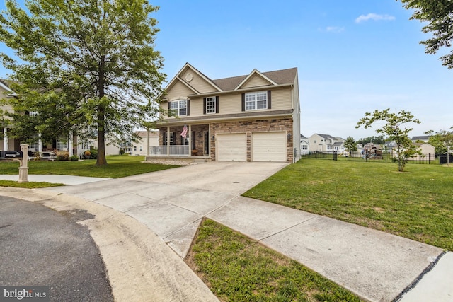 39 Grain Ct, Magnolia, DE 19962 - view of front of home featuring driveway, an attached garage, covered porch, and stone siding