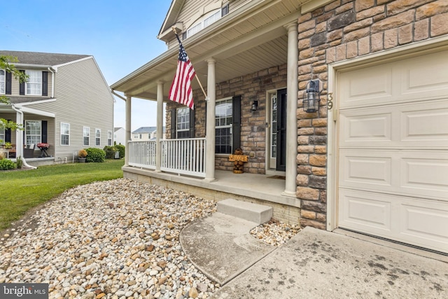 39 Grain Ct, Magnolia, DE 19962 - entrance to property with stone siding, a porch, a garage, and a yard