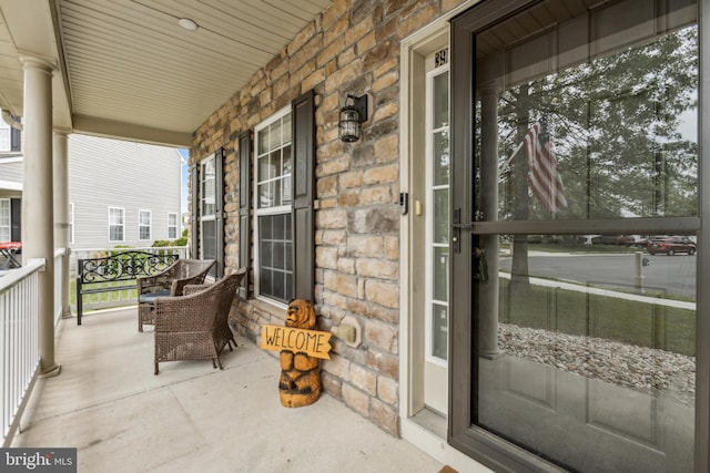 39 Grain Ct, Magnolia, DE 19962 - doorway to property featuring stone siding and a porch