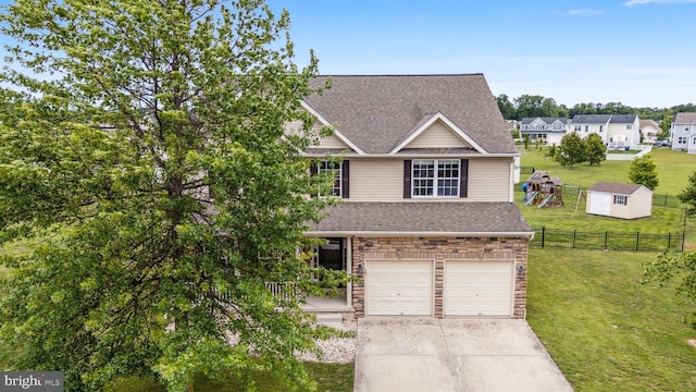 39 Grain Ct, Magnolia, DE 19962 - view of front of house with roof with shingles, concrete driveway, an attached garage, and stone siding
