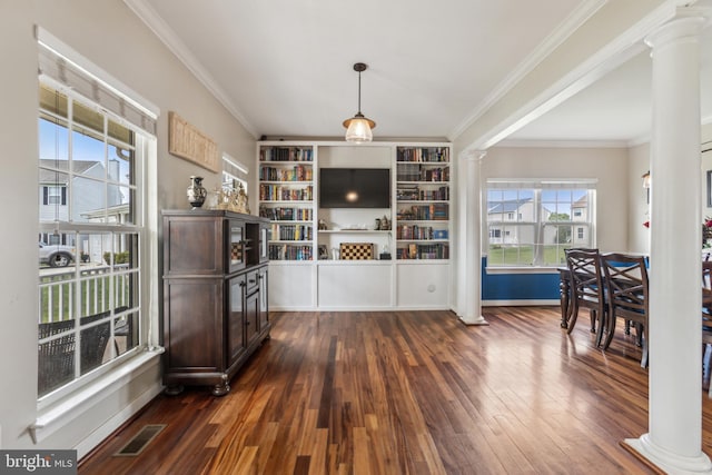 39 Grain Ct, Magnolia, DE 19962 - dining room featuring ornate columns, ornamental molding, and dark wood-type flooring