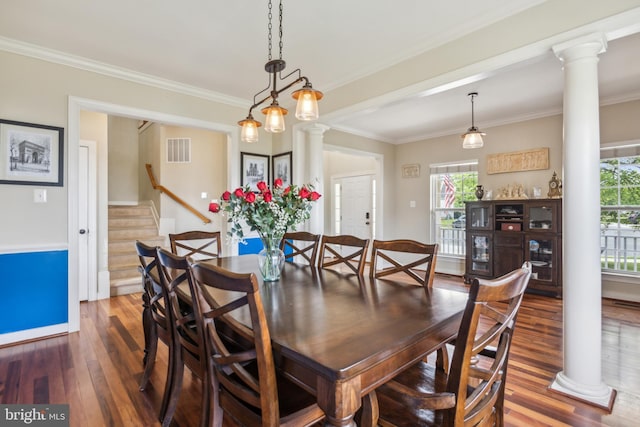 39 Grain Ct, Magnolia, DE 19962 - dining space featuring ornate columns, wood finished floors, crown molding, stairway, and baseboards