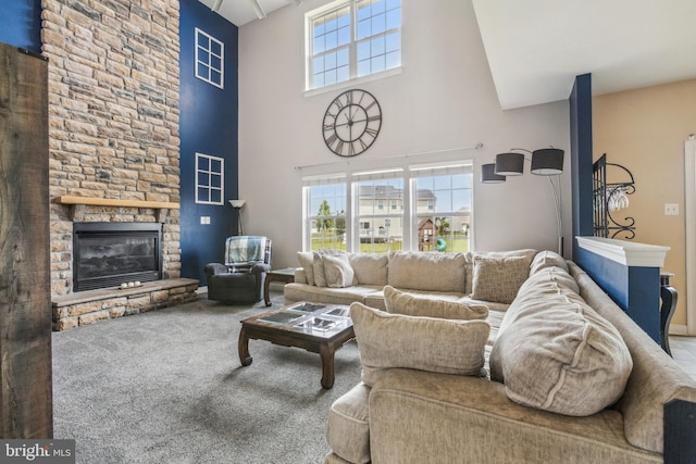 39 Grain Ct, Magnolia, DE 19962 - living area with a towering ceiling, carpet, and a stone fireplace