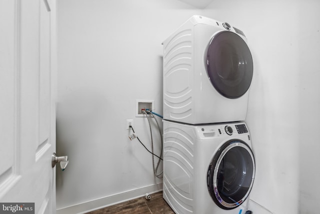 39 Grain Ct, Magnolia, DE 19962 - laundry area featuring stacked washer and clothes dryer and baseboards