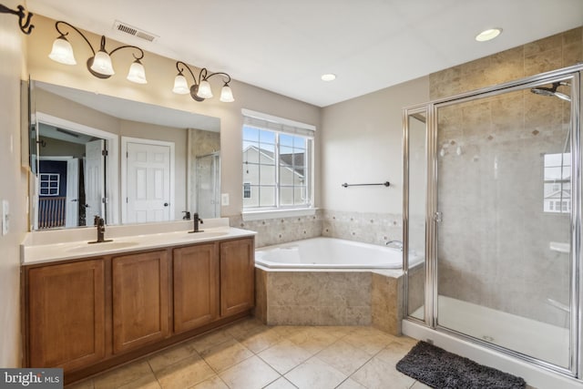39 Grain Ct, Magnolia, DE 19962 - bathroom with tile patterned flooring, a garden tub, a shower stall, double vanity, and recessed lighting
