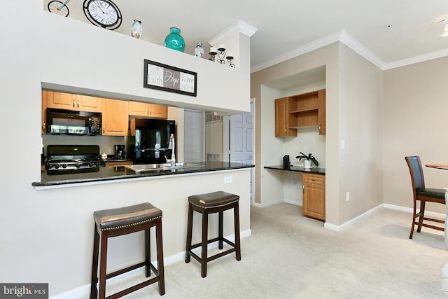 12900 Centre Park Cir Unit 107, Herndon, VA 20171 - kitchen featuring black appliances, ornamental molding, light carpet, a kitchen bar, and dark countertops