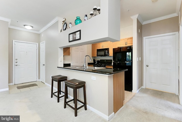 12900 Centre Park Cir Unit 107, Herndon, VA 20171 - kitchen featuring black appliances, ornamental molding, light colored carpet, dark countertops, and a breakfast bar area