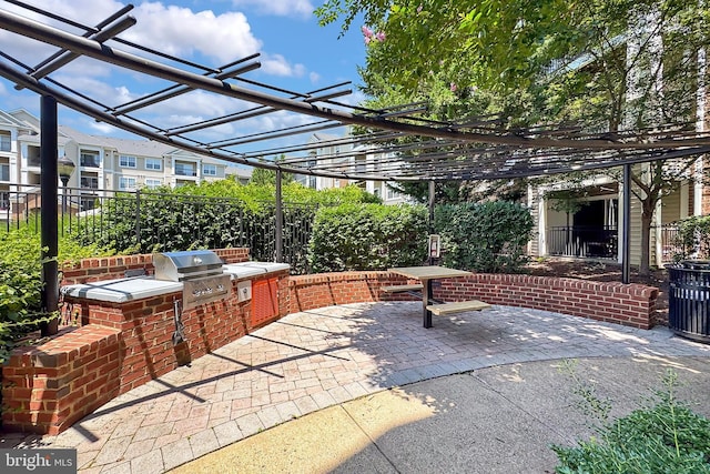 12900 Centre Park Cir Unit 107, Herndon, VA 20171 - view of patio with an outdoor kitchen and a pergola