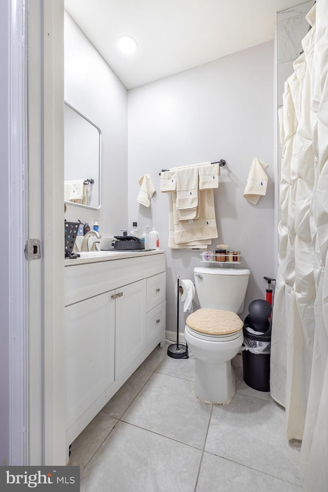 1707 W 4th St, Wilmington, DE 19805 - full bathroom with tile patterned floors, vanity, toilet, and a shower with shower curtain