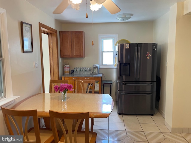 333 Sussex Blvd, Broomall, PA 19008 - kitchen featuring stainless steel fridge, brown cabinets, ceiling fan, light tile patterned floors, and baseboards