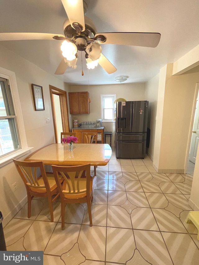 333 Sussex Blvd, Broomall, PA 19008 - dining area with baseboards, a ceiling fan, and light tile patterned floors