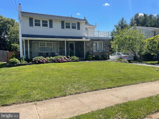 333 Sussex Blvd, Broomall, PA 19008 - traditional-style home with stone siding, a balcony, and a chimney