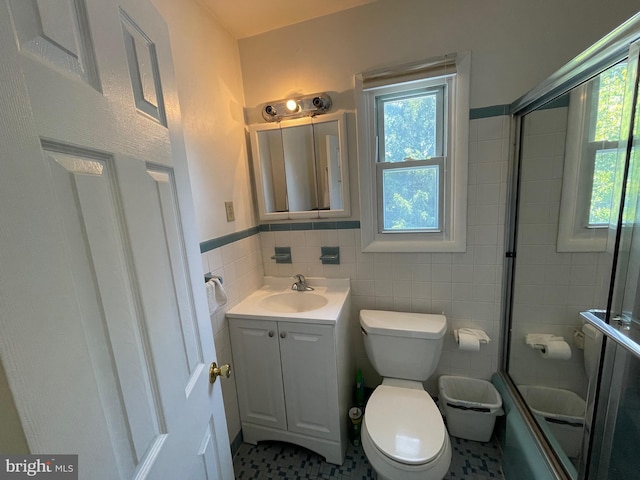 333 Sussex Blvd, Broomall, PA 19008 - full bathroom featuring tile walls, vanity, toilet, shower / bath combination with glass door, and wainscoting