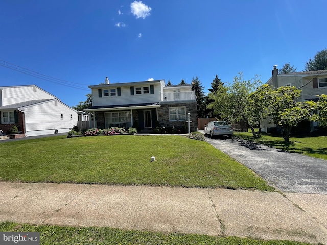 333 Sussex Blvd, Broomall, PA 19008 - view of front of property with stone siding, a front yard, and asphalt driveway
