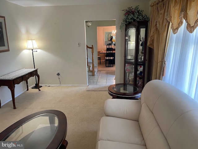 333 Sussex Blvd, Broomall, PA 19008 - living room featuring light carpet, baseboards, a chandelier, and stairway