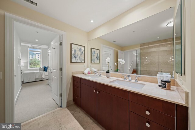 2425 L St NW Unit 328, Washington, DC 20037 - bathroom with double vanity, ensuite bathroom, a stall shower, baseboards, and recessed lighting
