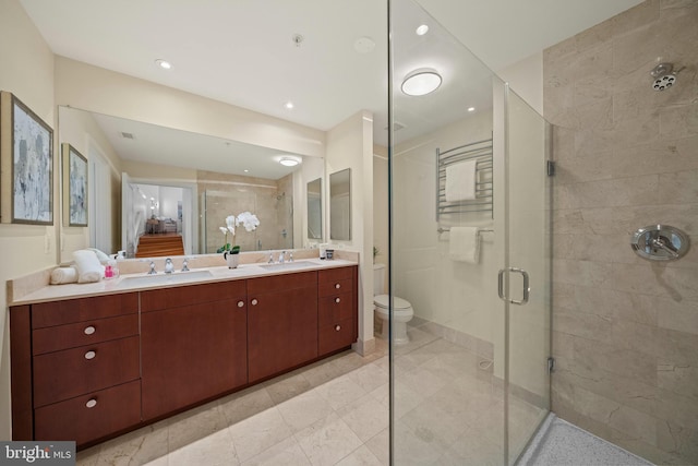 2425 L St NW Unit 328, Washington, DC 20037 - bathroom with a shower stall, double vanity, toilet, and tile patterned floors