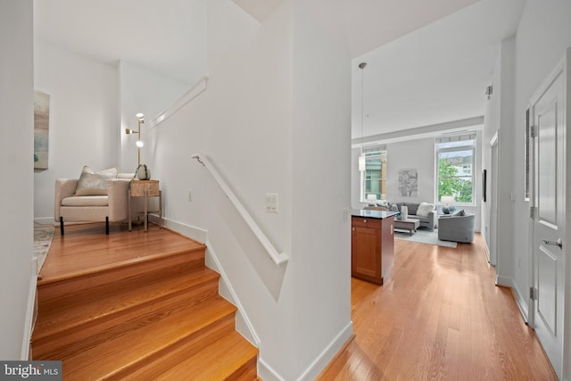 2425 L St NW Unit 328, Washington, DC 20037 - stairs featuring wood finished floors and baseboards