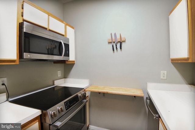 600 Resty Ln Unit 202, Odenton, MD 21113 - kitchen with appliances with stainless steel finishes, light countertops, and white cabinets