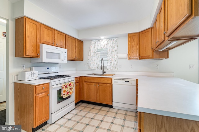 114 Austin Dr, Enola, PA 17025 - kitchen with white appliances, a sink, light countertops, light floors, and brown cabinets