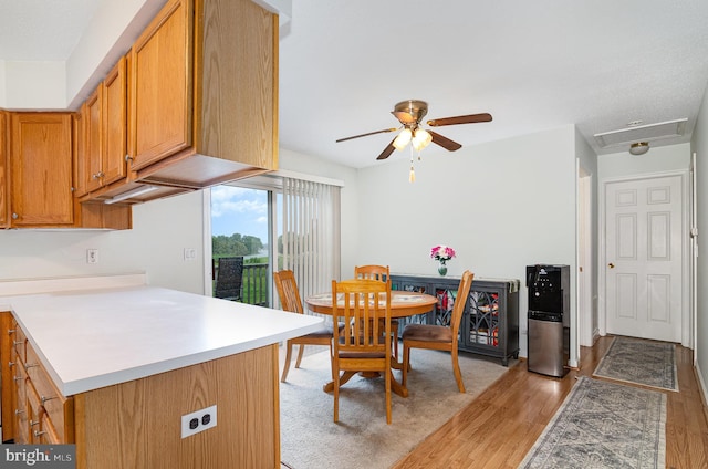 114 Austin Dr, Enola, PA 17025 - kitchen featuring light wood-style flooring, ceiling fan, light countertops, and brown cabinets