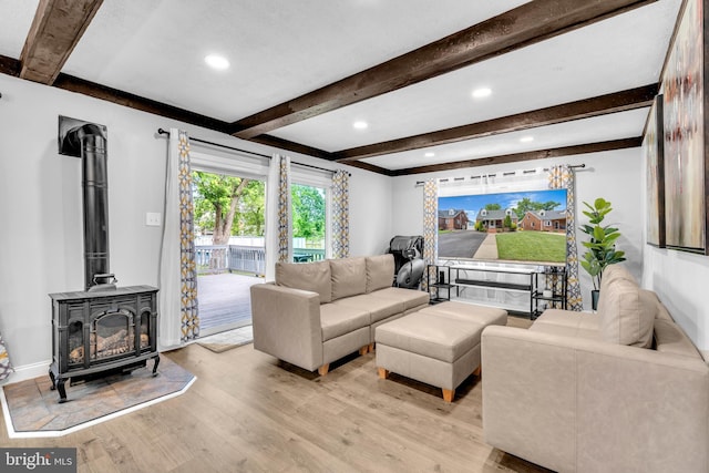 204 Kuethe Rd NE, Glen Burnie, MD 21060 - living room featuring light wood-type flooring, beam ceiling, a wood stove, recessed lighting, and baseboards